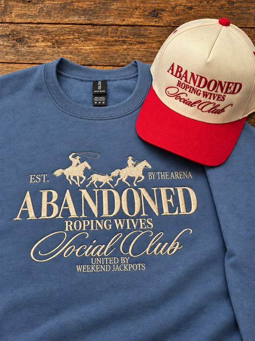 Denim sweatshirt with beige Abandoned Roping Wives Social Club embroidery. Hat sold separately.
