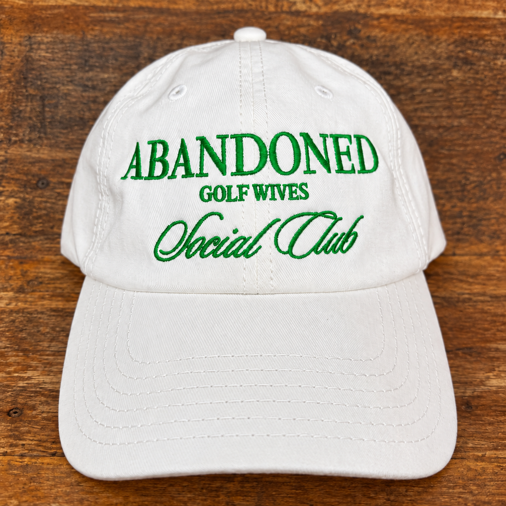 White ’47 Abandoned Golf Wives Social Club hat with Kelly green embroidery