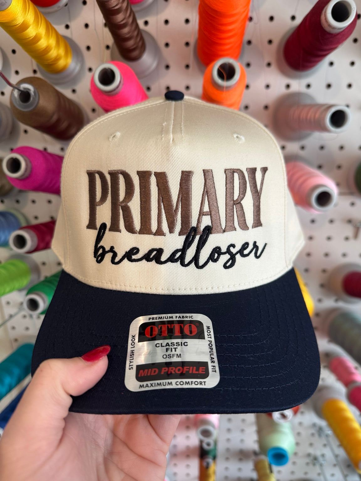 Primary Breadloser embroidered cream hat with navy brim